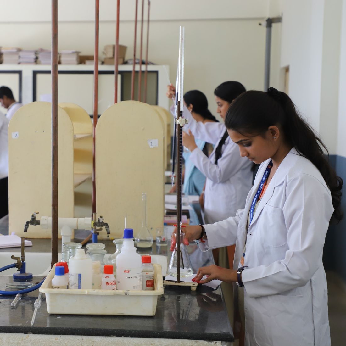 Students of Sharada Vidyanikethana, a residential PU college in Mangalore, doing a titration in the chemistry lab