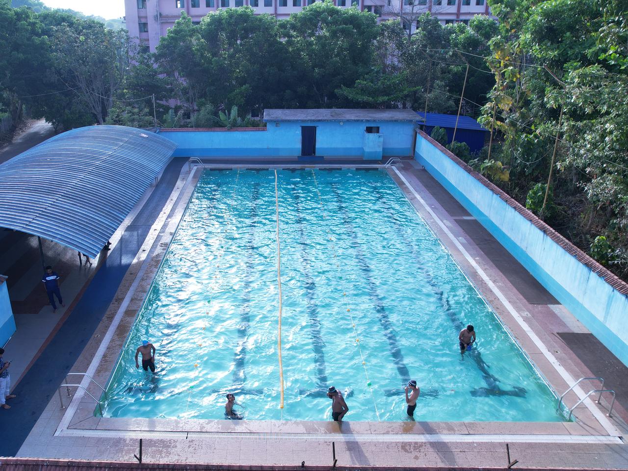 Students swimming in the campus swimming pool