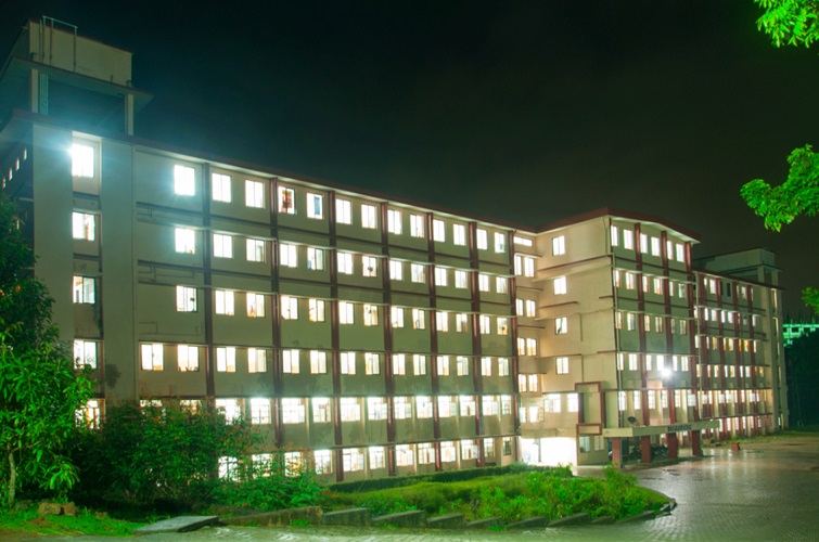 Hostel blocks lit up at night on the Sharada PU college campus, Mangalore